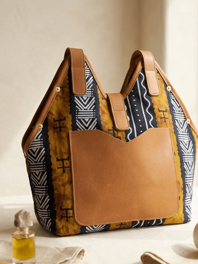 Dhahabu Tote in warm heritage textile on cream background